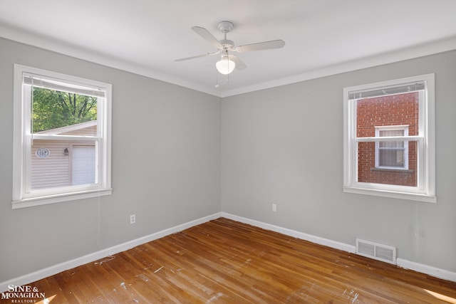 23016 California St, Saint Clair Shores, MI 48080 - unfurnished room featuring baseboards, wood finished floors, and a ceiling fan