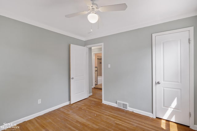 23016 California St, Saint Clair Shores, MI 48080 - unfurnished bedroom featuring wood finished floors, baseboards, and a ceiling fan