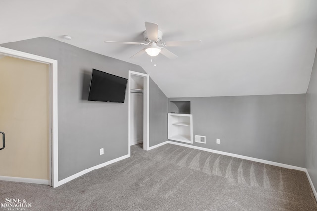 23016 California St, Saint Clair Shores, MI 48080 - additional living space featuring built in features, carpet flooring, lofted ceiling, ceiling fan, and baseboards