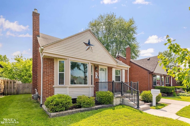 23016 California St, Saint Clair Shores, MI 48080 - bungalow-style house featuring brick siding and a chimney