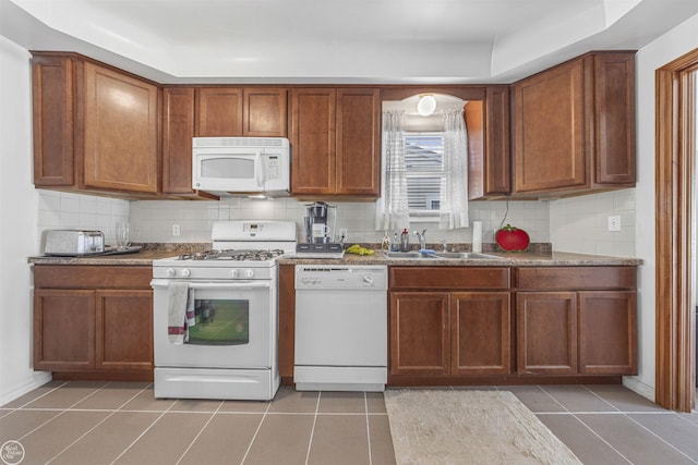 22301 Saint Gertrude St, Saint Clair Shores, MI 48081 - kitchen with white appliances, backsplash, light tile patterned flooring, and a sink