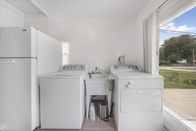 22301 Saint Gertrude St, Saint Clair Shores, MI 48081 - washroom with washer and clothes dryer, plenty of natural light, and tile patterned floors