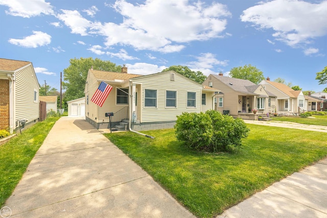 22301 Saint Gertrude St, Saint Clair Shores, MI 48081 - bungalow with an outbuilding, a front yard, a residential view, a detached garage, and entry steps