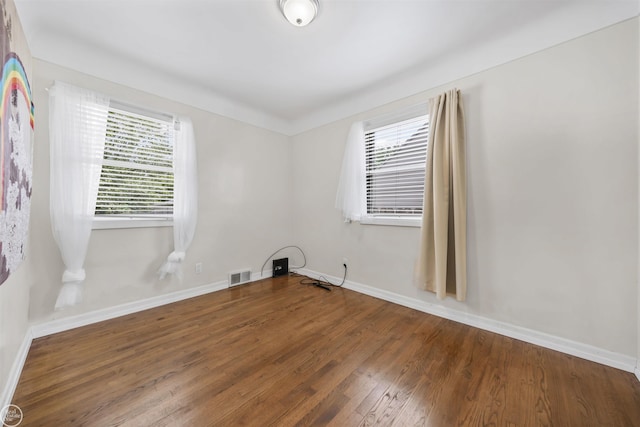 22301 Saint Gertrude St, Saint Clair Shores, MI 48081 - unfurnished room featuring plenty of natural light, baseboards, and wood finished floors