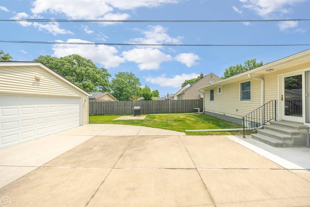 22301 Saint Gertrude St, Saint Clair Shores, MI 48081 - view of yard featuring entry steps, a detached garage, and an outbuilding