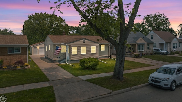 22301 Saint Gertrude St, Saint Clair Shores, MI 48081 - view of front of house with a detached garage, a front lawn, and an outbuilding