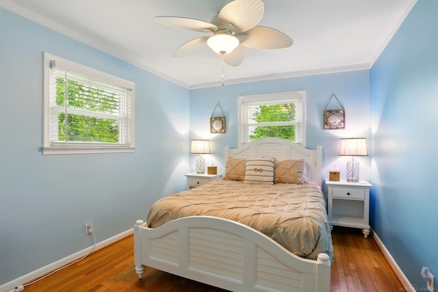 14810 28 Mile Rd, Washington, MI 48094 - bedroom featuring baseboards, wood-type flooring, ceiling fan, and ornamental molding