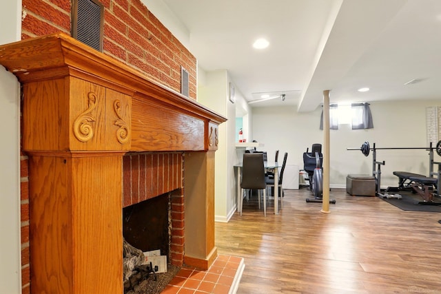 14810 28 Mile Rd, Washington, MI 48094 - exercise area featuring a fireplace, wood finished floors, recessed lighting, and baseboards