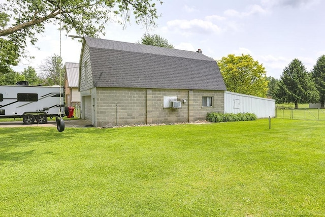14810 28 Mile Rd, Washington, MI 48094 - view of home's exterior with a gambrel roof, a shingled roof, and concrete block siding
