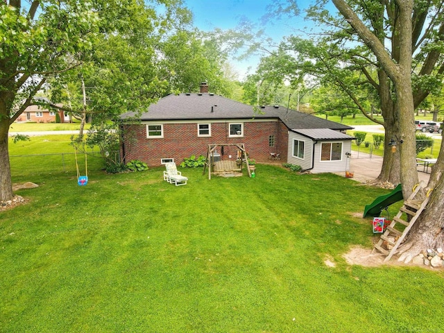 14810 28 Mile Rd, Washington, MI 48094 - back of property with a chimney, a lawn, and brick siding