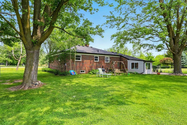 14810 28 Mile Rd, Washington, MI 48094 - rear view of house with brick siding and a chimney