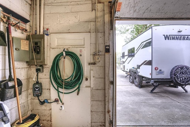 14810 28 Mile Rd, Washington, MI 48094 - garage view of concrete block wall and electric panel