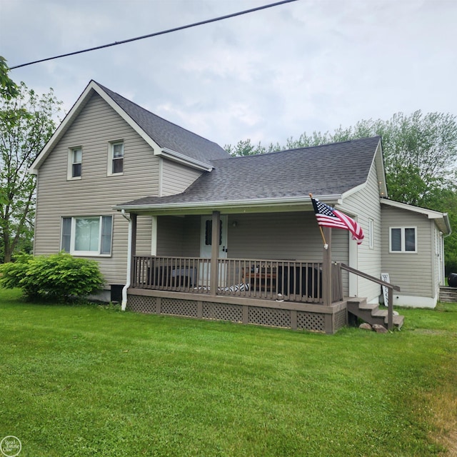76540 Andrews Rd, Richmond, MI 48062 - view of front of house with a front yard, roof with shingles, and covered porch