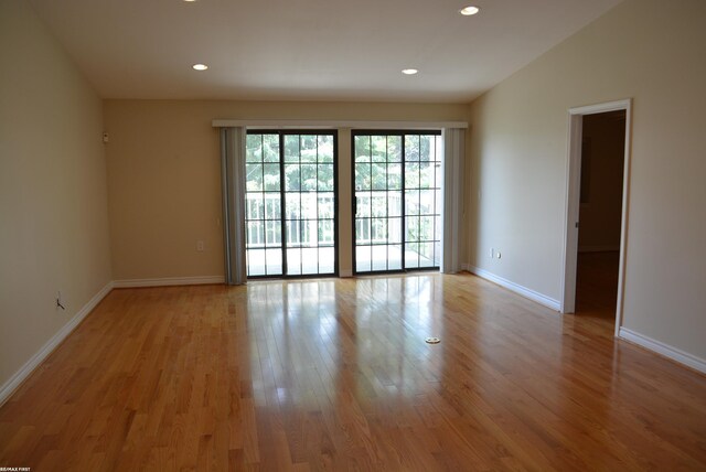2423 Birchcrest Ct, Sterling Heights, MI 48314 - spare room featuring light wood-style floors, recessed lighting, and baseboards