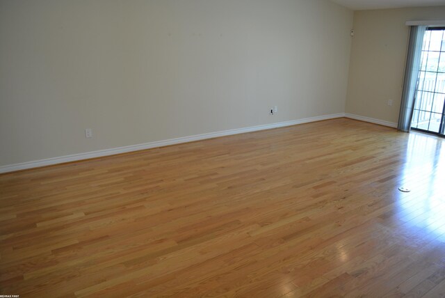 2423 Birchcrest Ct, Sterling Heights, MI 48314 - spare room featuring light wood finished floors and baseboards