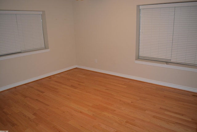 2423 Birchcrest Ct, Sterling Heights, MI 48314 - empty room with wood finished floors and baseboards