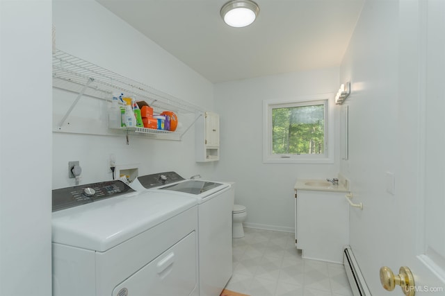12826 Section 16 Rd, Watton, MI 49970 - laundry area with a baseboard radiator, separate washer and dryer, baseboards, and light floors