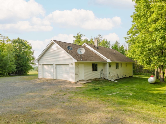 12826 Section 16 Rd, Watton, MI 49970 - view of front facade with a chimney, a garage, and a front yard