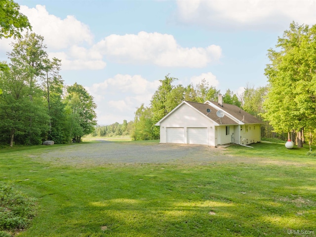 12826 Section 16 Rd, Watton, MI 49970 - view of green lawn featuring an attached garage
