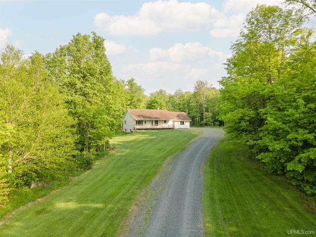 12826 Section 16 Rd, Watton, MI 49970 - single story home with driveway, a front yard, and an attached garage