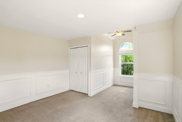 7859 Pine Ridge Dr, Clarkston, MI 48346 - spare room featuring carpet, ceiling fan, a wainscoted wall, a decorative wall, and recessed lighting