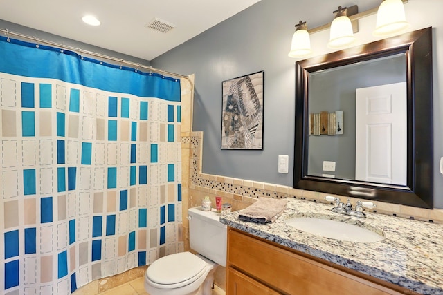 7859 Pine Ridge Dr, Clarkston, MI 48346 - bathroom with tile walls, toilet, vanity, tile patterned floors, and curtained shower