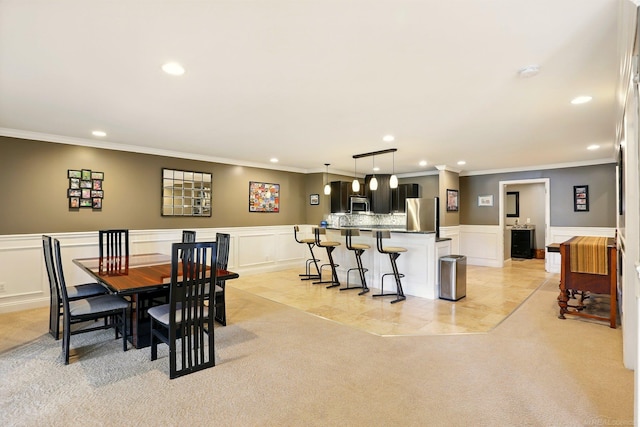7859 Pine Ridge Dr, Clarkston, MI 48346 - dining area with recessed lighting, ornamental molding, a wainscoted wall, a decorative wall, and light carpet