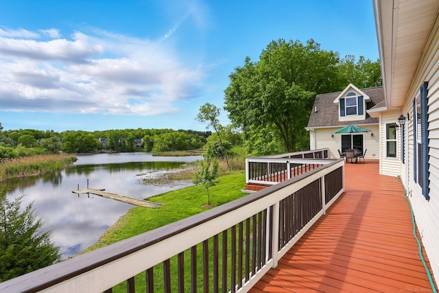 7859 Pine Ridge Dr, Clarkston, MI 48346 - wooden deck with a water view, outdoor dining space, view of wooded area, and a yard