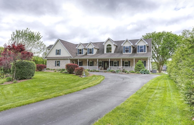 7859 Pine Ridge Dr, Clarkston, MI 48346 - cape cod-style house with a porch, a front yard, asphalt driveway, and brick siding