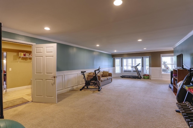 7859 Pine Ridge Dr, Clarkston, MI 48346 - living area with light carpet, crown molding, recessed lighting, a decorative wall, and wainscoting