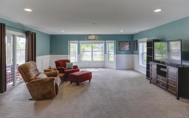 7859 Pine Ridge Dr, Clarkston, MI 48346 - carpeted living area with plenty of natural light, a decorative wall, a wainscoted wall, and recessed lighting