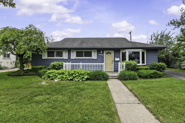 26657 Margaret St, Roseville, MI 48066 - bungalow with a front yard, covered porch, and a shingled roof