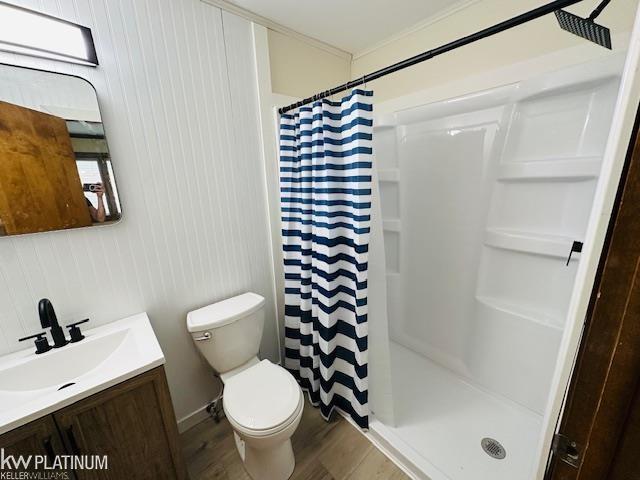 16754 Sarno Dr, Macomb, MI 48044 - full bathroom featuring vanity, a shower with shower curtain, wood finished floors, and toilet