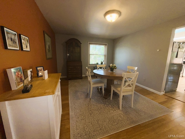 801 S Hemlock St, Iron Mountain, MI 49801 - dining room featuring wood finished floors and baseboards