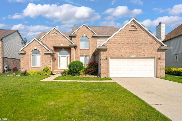45259 Yorkshire Dr, Macomb, MI 48044 - traditional-style house with brick siding, a front lawn, driveway, and a garage