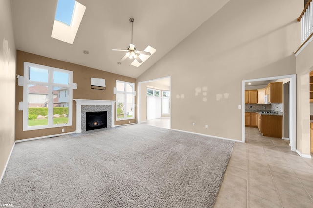 45259 Yorkshire Dr, Macomb, MI 48044 - unfurnished living room with high vaulted ceiling, a skylight, light tile patterned floors, a fireplace with flush hearth, and ceiling fan