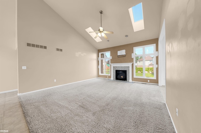 45259 Yorkshire Dr, Macomb, MI 48044 - unfurnished living room featuring high vaulted ceiling, a skylight, ceiling fan, baseboards, and light carpet