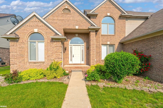 45259 Yorkshire Dr, Macomb, MI 48044 - view of front of home with brick siding and a front lawn
