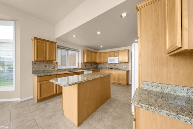 45259 Yorkshire Dr, Macomb, MI 48044 - kitchen featuring white appliances, a sink, tasteful backsplash, a center island, and light stone countertops