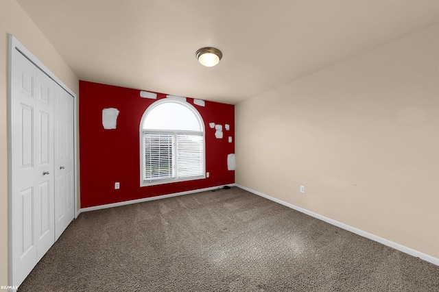 45259 Yorkshire Dr, Macomb, MI 48044 - unfurnished bedroom with carpet floors, a closet, and baseboards