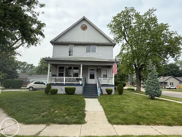 1401 Stanton St, Port Huron, MI 48060 - view of front of home with a porch and a front lawn