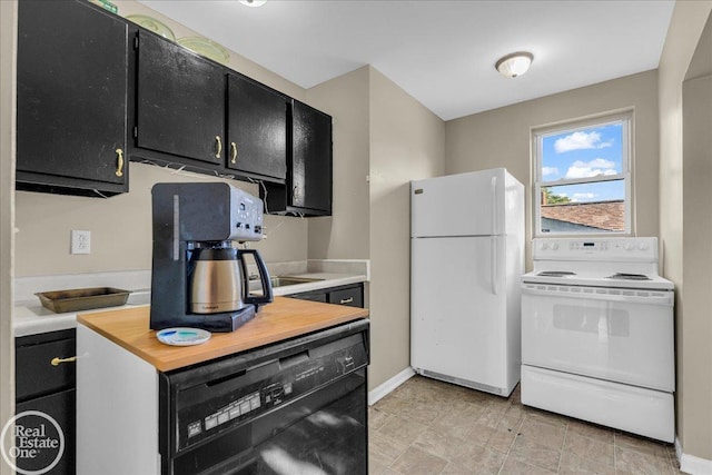 1401 Stanton St, Port Huron, MI 48060 - kitchen featuring white appliances and dark cabinetry
