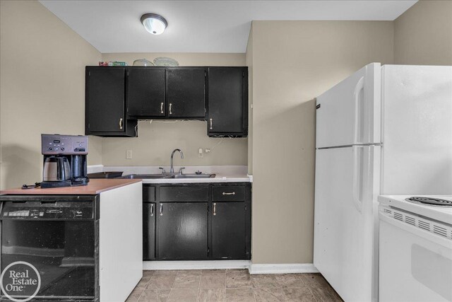 1401 Stanton St, Port Huron, MI 48060 - kitchen with dark cabinets, light countertops, and electric range