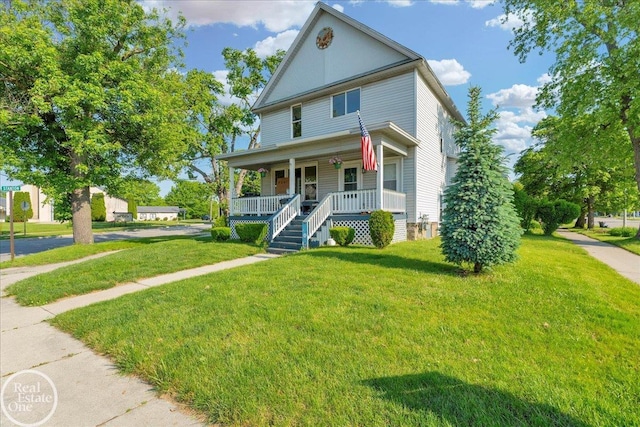 1401 Stanton St, Port Huron, MI 48060 - view of front facade featuring covered porch and a front lawn