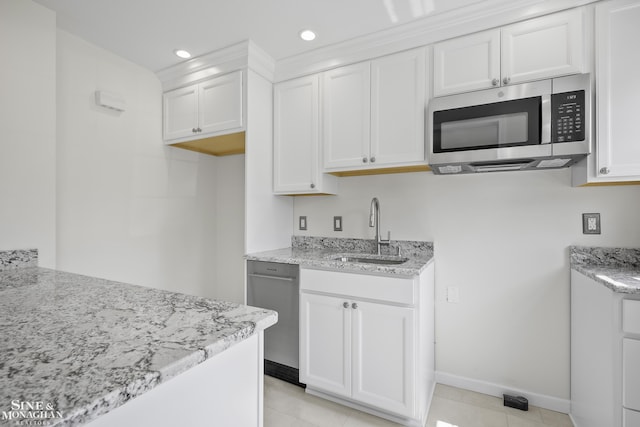 22920 Marter Rd, Saint Clair Shores, MI 48080 - kitchen featuring stainless steel microwave, a sink, light stone countertops, white cabinetry, and baseboards
