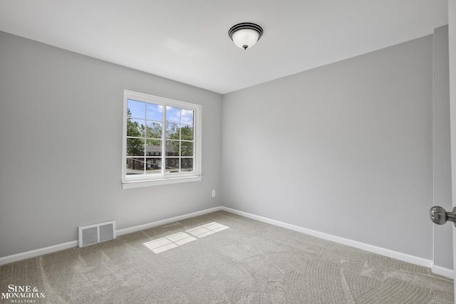 22920 Marter Rd, Saint Clair Shores, MI 48080 - spare room featuring carpet flooring and baseboards
