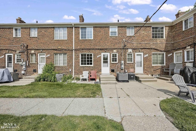 22920 Marter Rd, Saint Clair Shores, MI 48080 - back of house with brick siding, central AC unit, a patio, and a chimney