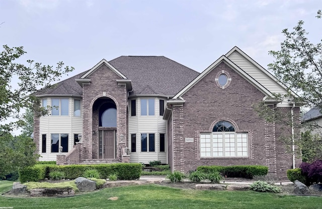 55733 Whitney Ct, Shelby Twp, MI 48315 - traditional-style house with brick siding and a front lawn