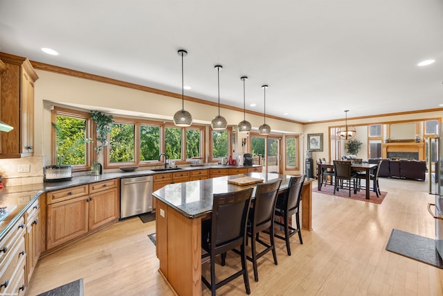 55733 Whitney Ct, Shelby Twp, MI 48315 - kitchen with stainless steel dishwasher, recessed lighting, a breakfast bar, plenty of natural light, and tasteful backsplash