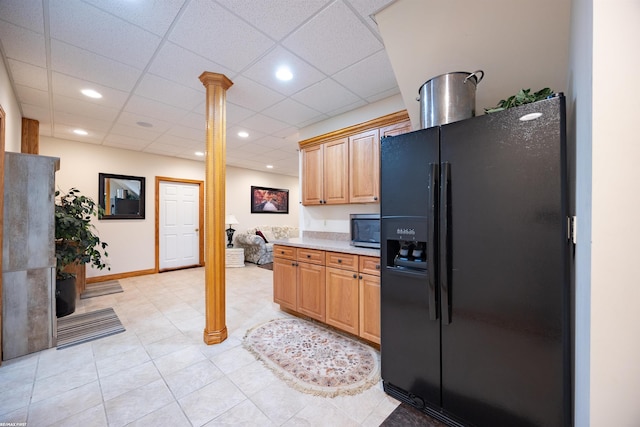 55733 Whitney Ct, Shelby Twp, MI 48315 - kitchen with black refrigerator with ice dispenser, stainless steel microwave, light countertops, ornate columns, and recessed lighting